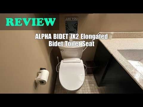The Alpha Bidet JX2 elongated seat installed on a modern white bathroom toilet.