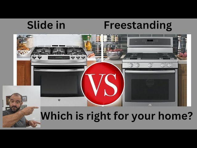 A professional kitchen installer fitting a built-in oven into custom cabinetry.
