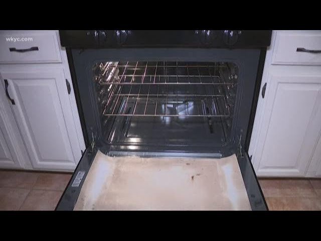 A clean electric oven interior featuring a protective non-stick oven liner.