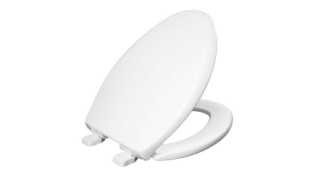 A modern Bemis 1100E2 Kennan elongated toilet seat installed in a bright, clean bathroom.