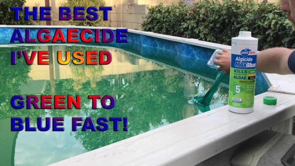A professional pool maintenance kit sitting beside a clear blue backyard swimming pool.