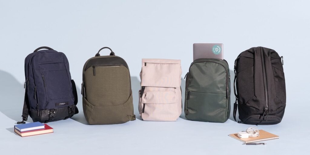 A modern backpack sits on a table, perfect for travel and work.