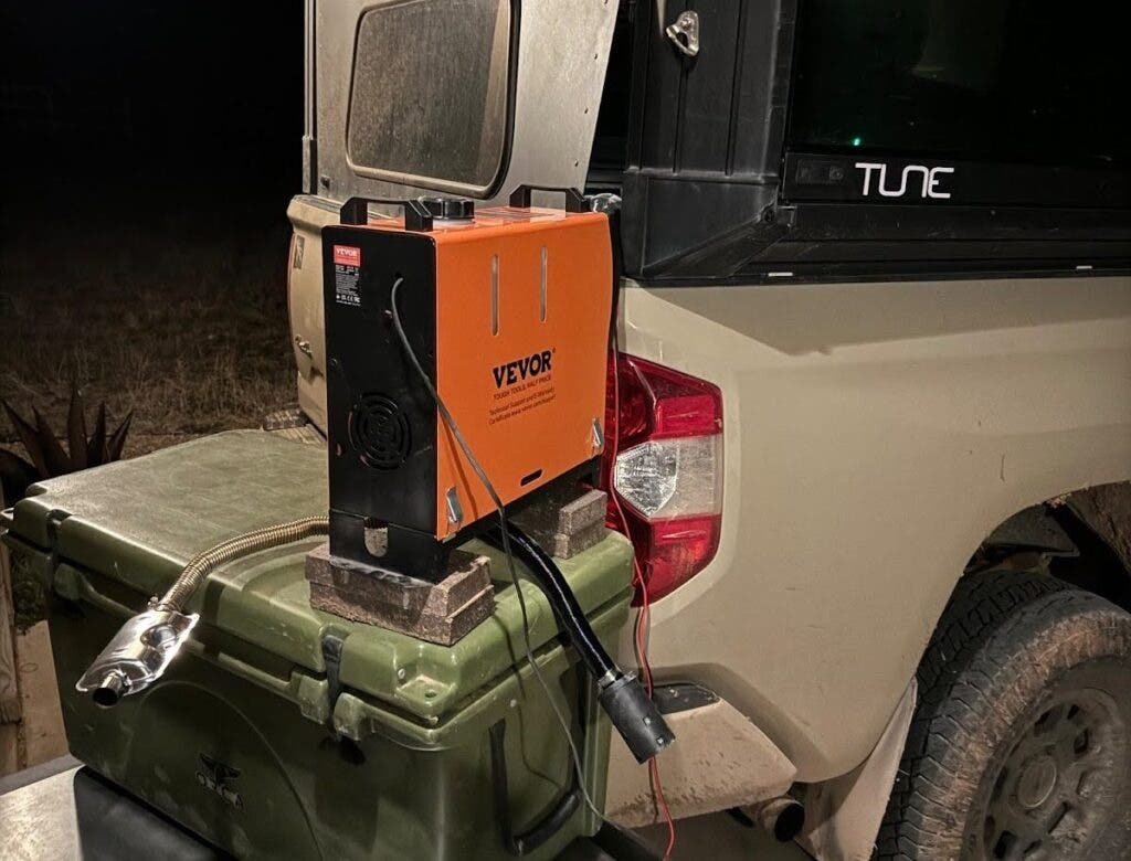 A portable car camping heater keeps a camper van cozy during winter.
