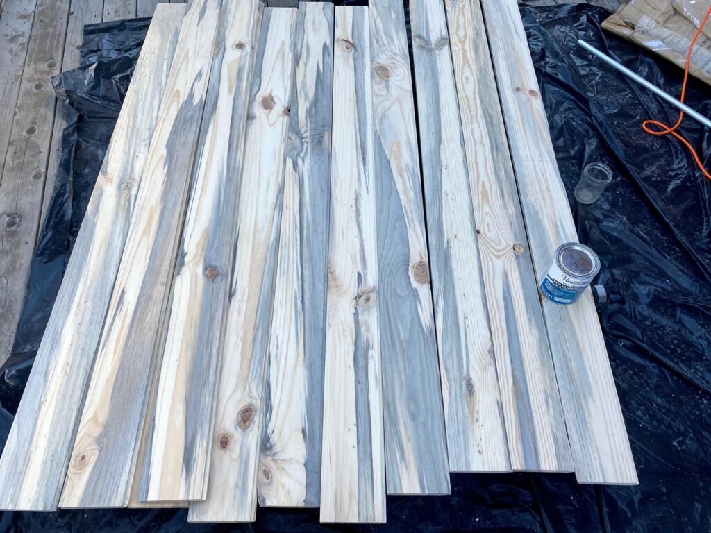 A close-up of a clear finish being applied to beautiful beetle kill blue pine.