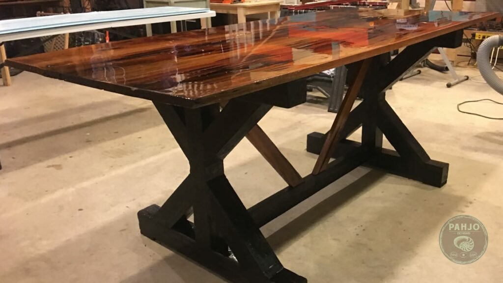 A polished cypress table showing a smooth finish in a sunlit modern home.