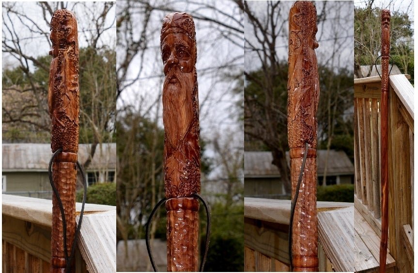 A polished wooden walking stick with a high-quality finish rests on a workbench.