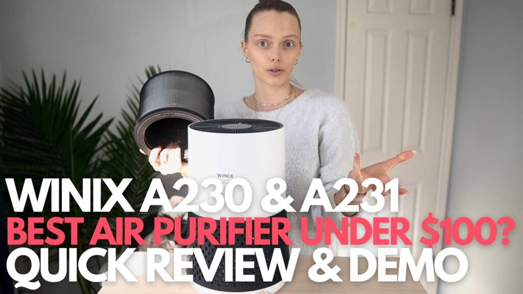 A modern compact HEPA air purifier sits on a bedside table in a bedroom.
