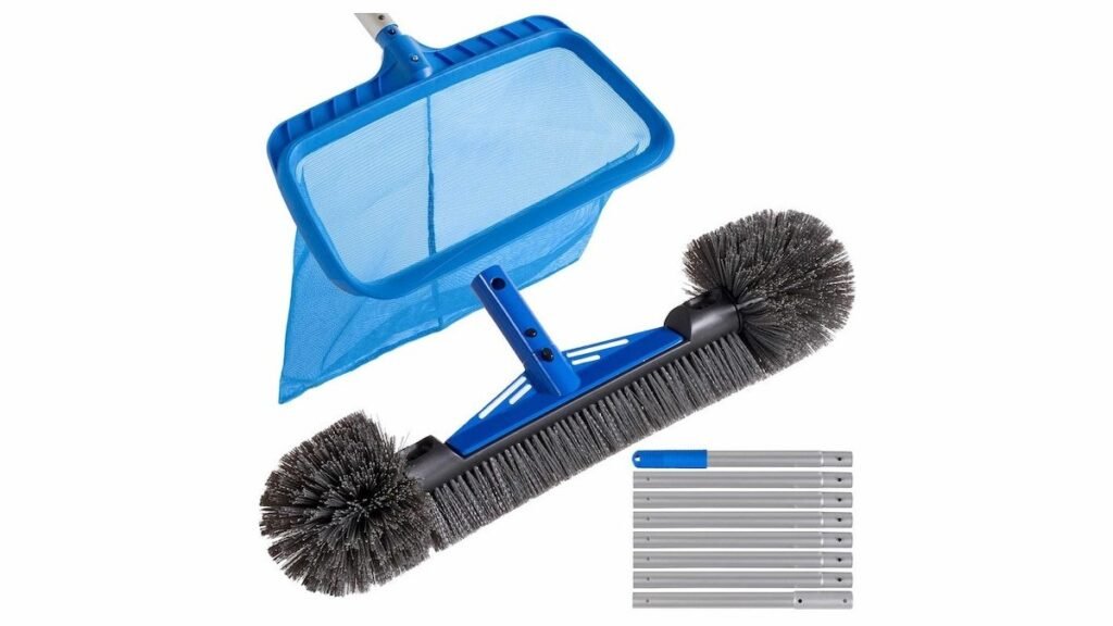A professional telescoping pool skimmer net pole sits beside a clean backyard swimming pool.