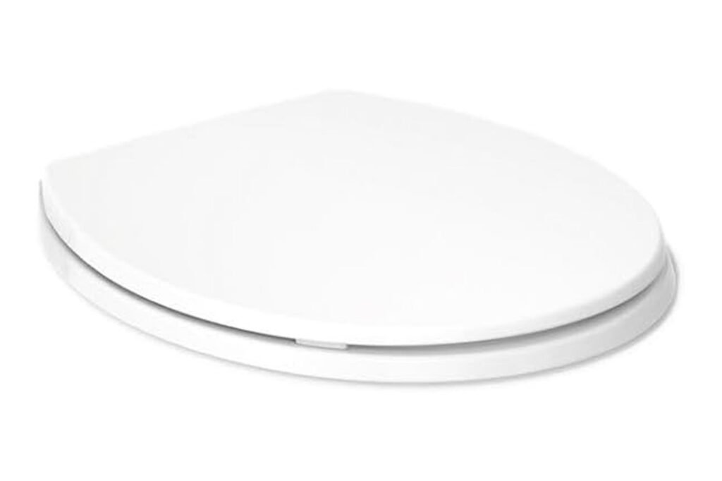 A person gently lowering a quiet close toilet seat in a modern bathroom.