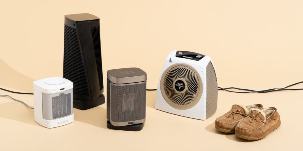 A modern space heater sitting on a desk in a professional home office.