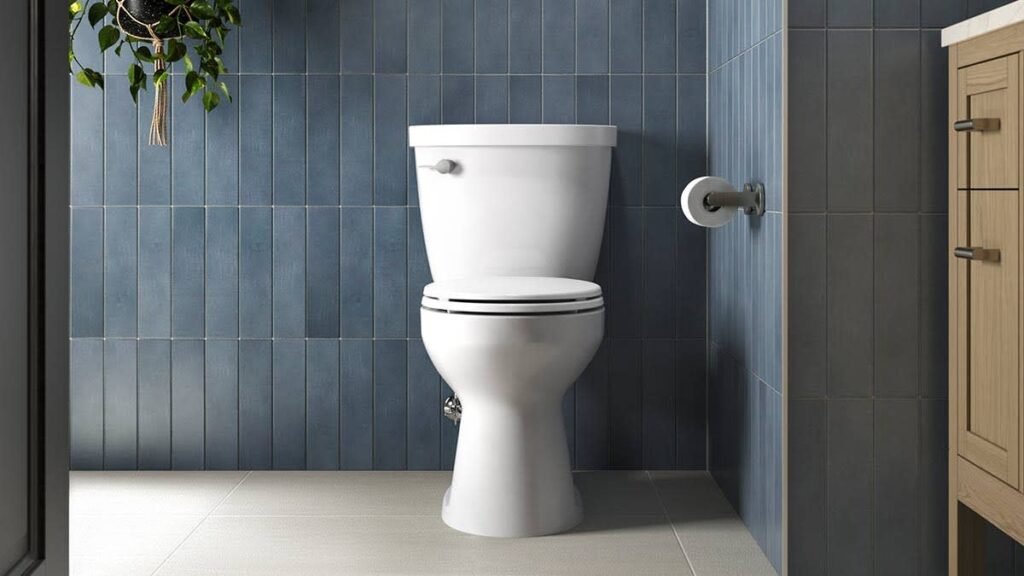 A modern white toilet seat installed in a clean, bright, and contemporary bathroom.