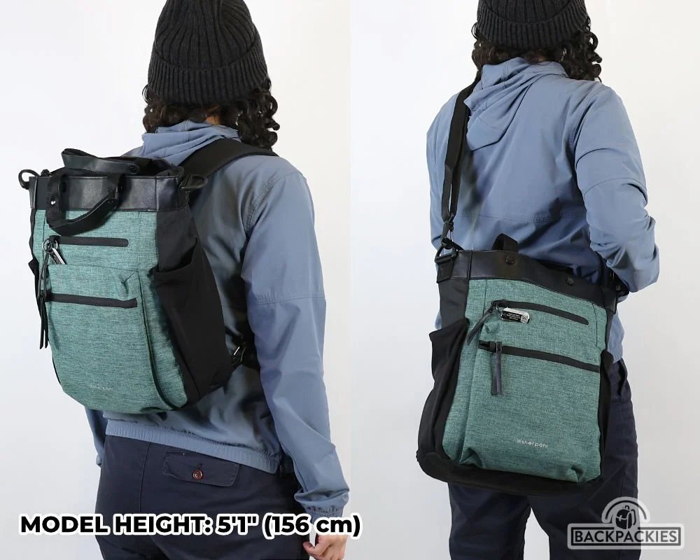 A petite woman wearing a perfectly fitted travel backpack while exploring a historic city.