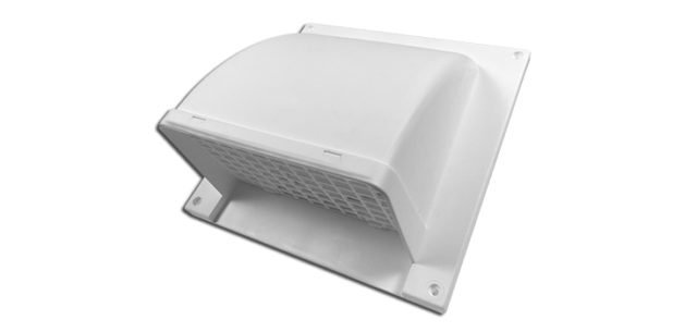 A stainless steel wall vent cap mounted on a modern brick exterior wall.