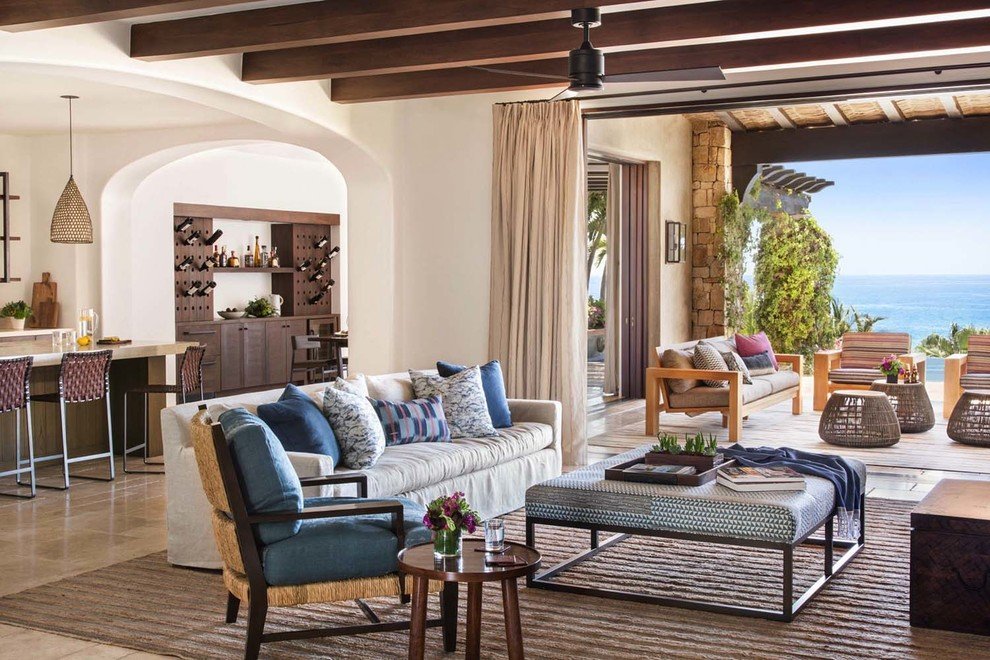 A bright Mediterranean living room featuring crisp white walls and elegant natural decor.
