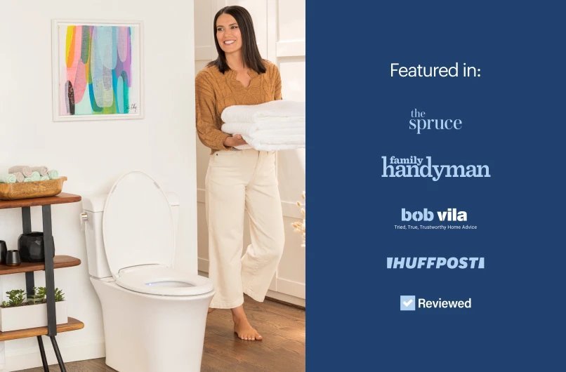 A modern Brondell L60 EB LumaWarm heated toilet seat installed in a bright bathroom.