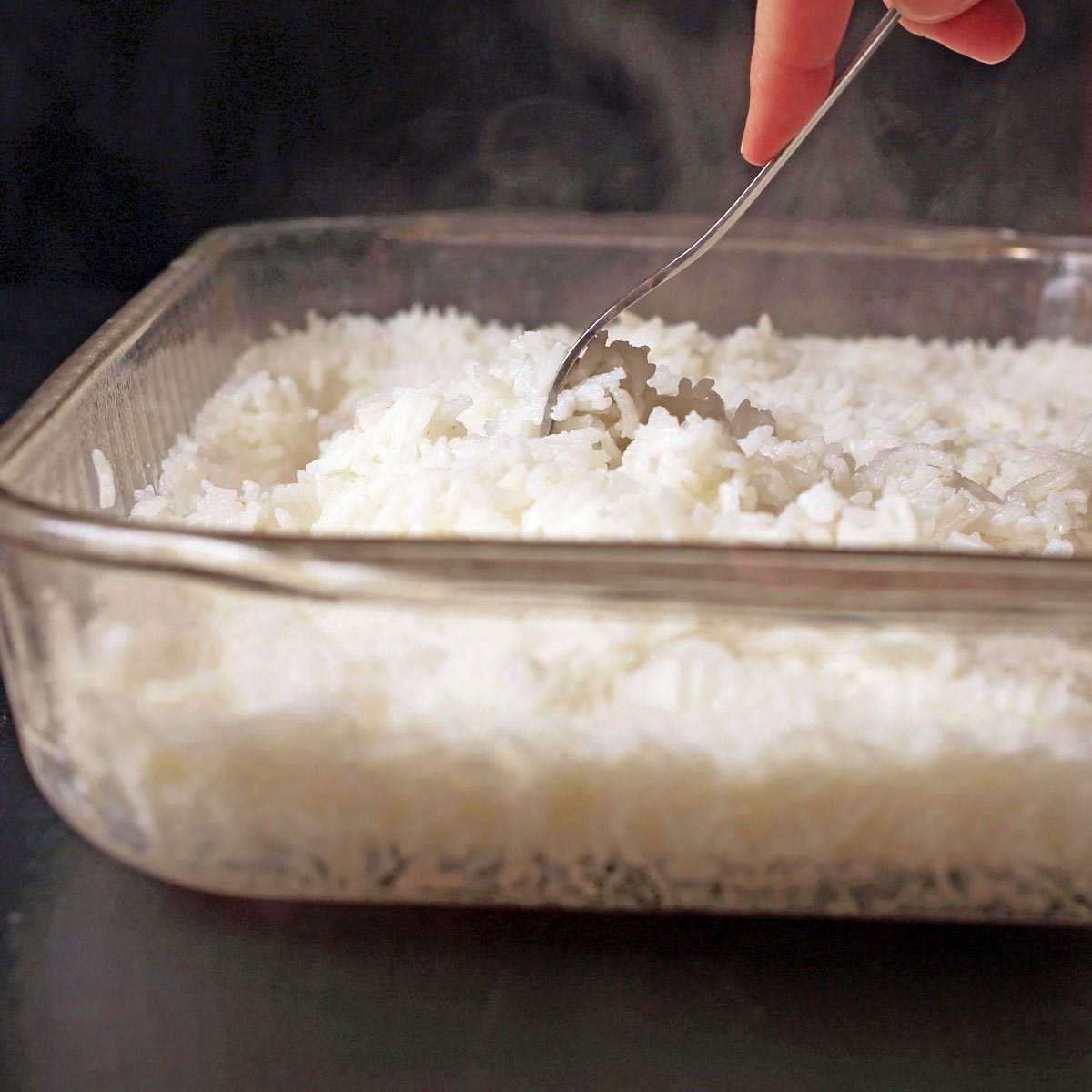 A close-up view showing the fluffy texture and high quality of oven-baked rice.