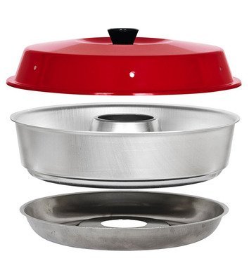 A portable camping oven on a stove ready for cooking a warm casserole.