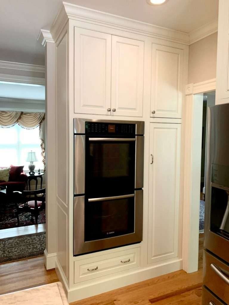 An eye-level wall oven installed into kitchen cabinetry for ergonomic cooking access.