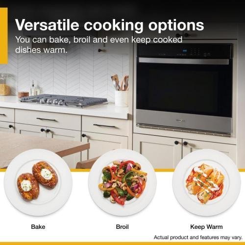 A home cook using an ergonomic wall oven installed at counter height.