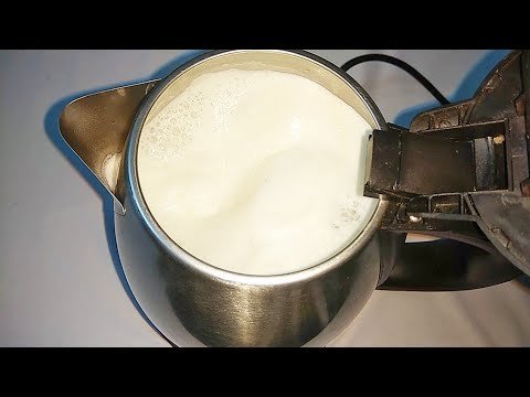 Close up of scorched milk residue inside an electric kettle heating element.