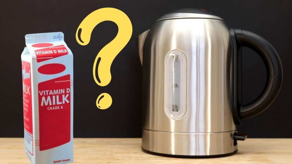 A modern electric kettle next to a glass of milk on a kitchen counter.