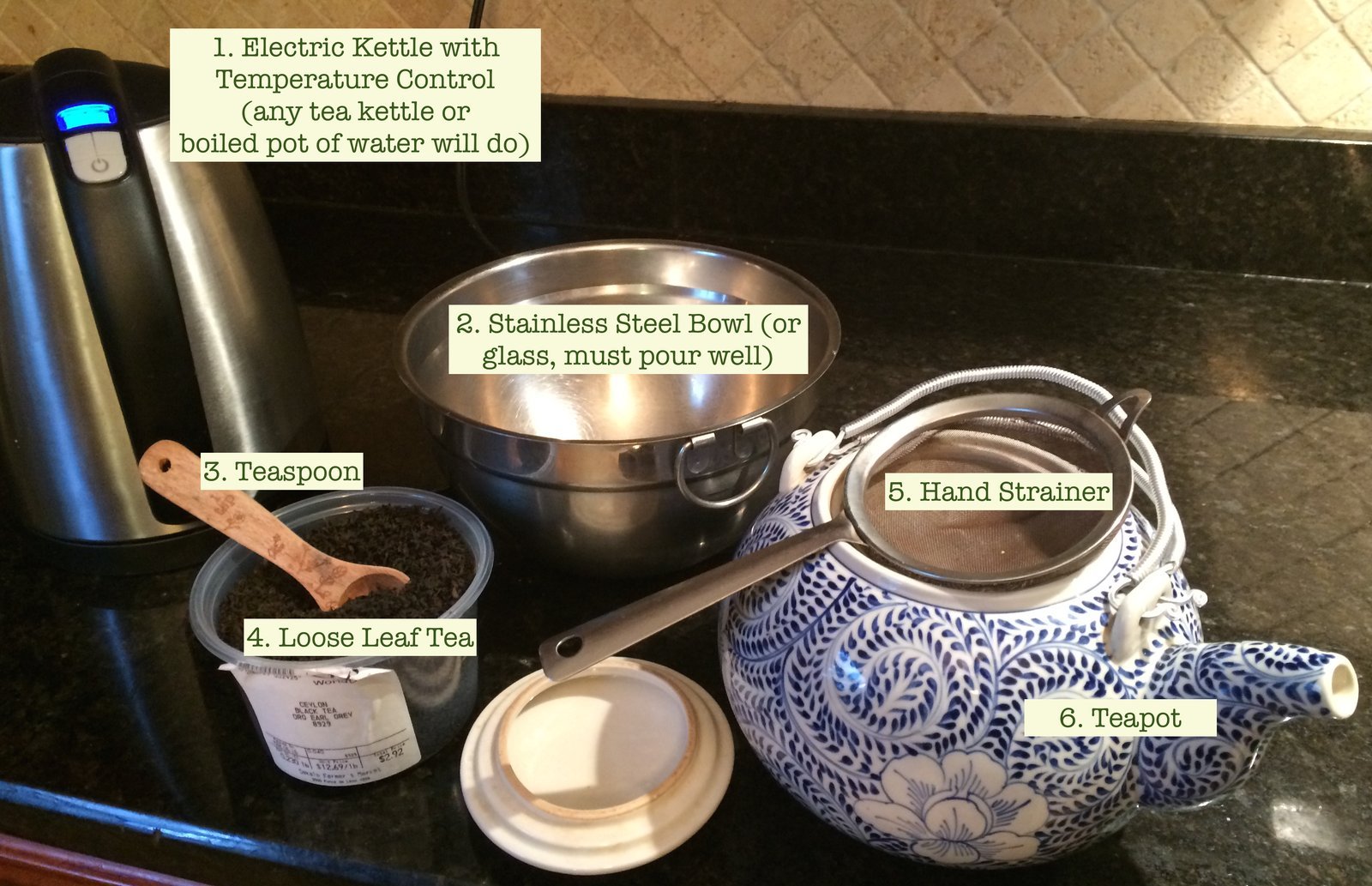 The clean interior base of a stainless steel electric kettle.