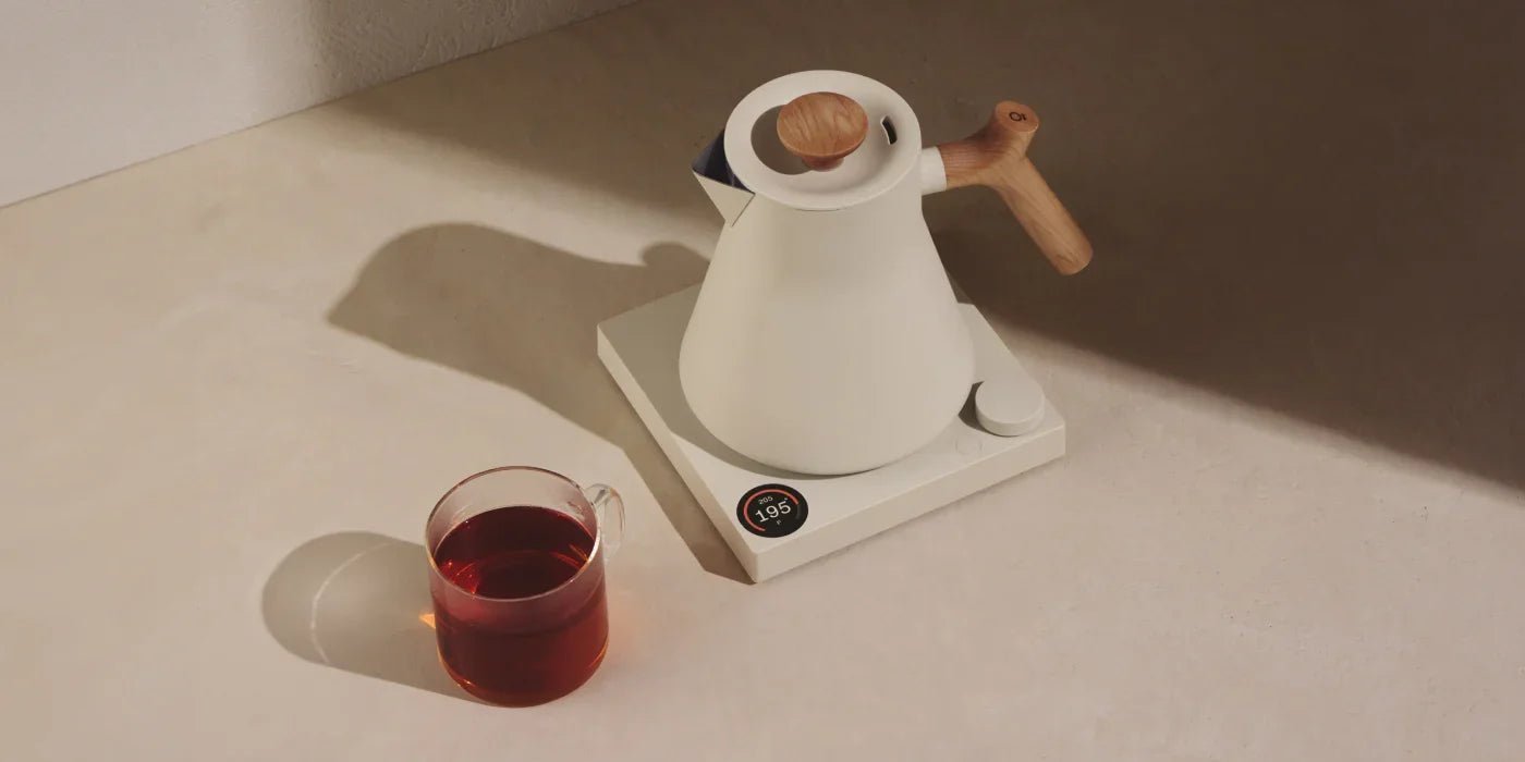 Cleaning the inside of an electric kettle to remove mineral buildup.