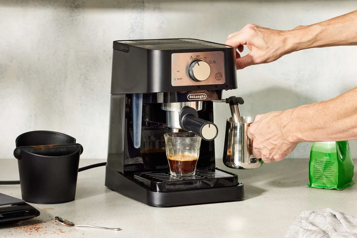 Close-up of a high-end espresso machine group head and brass portafilter.