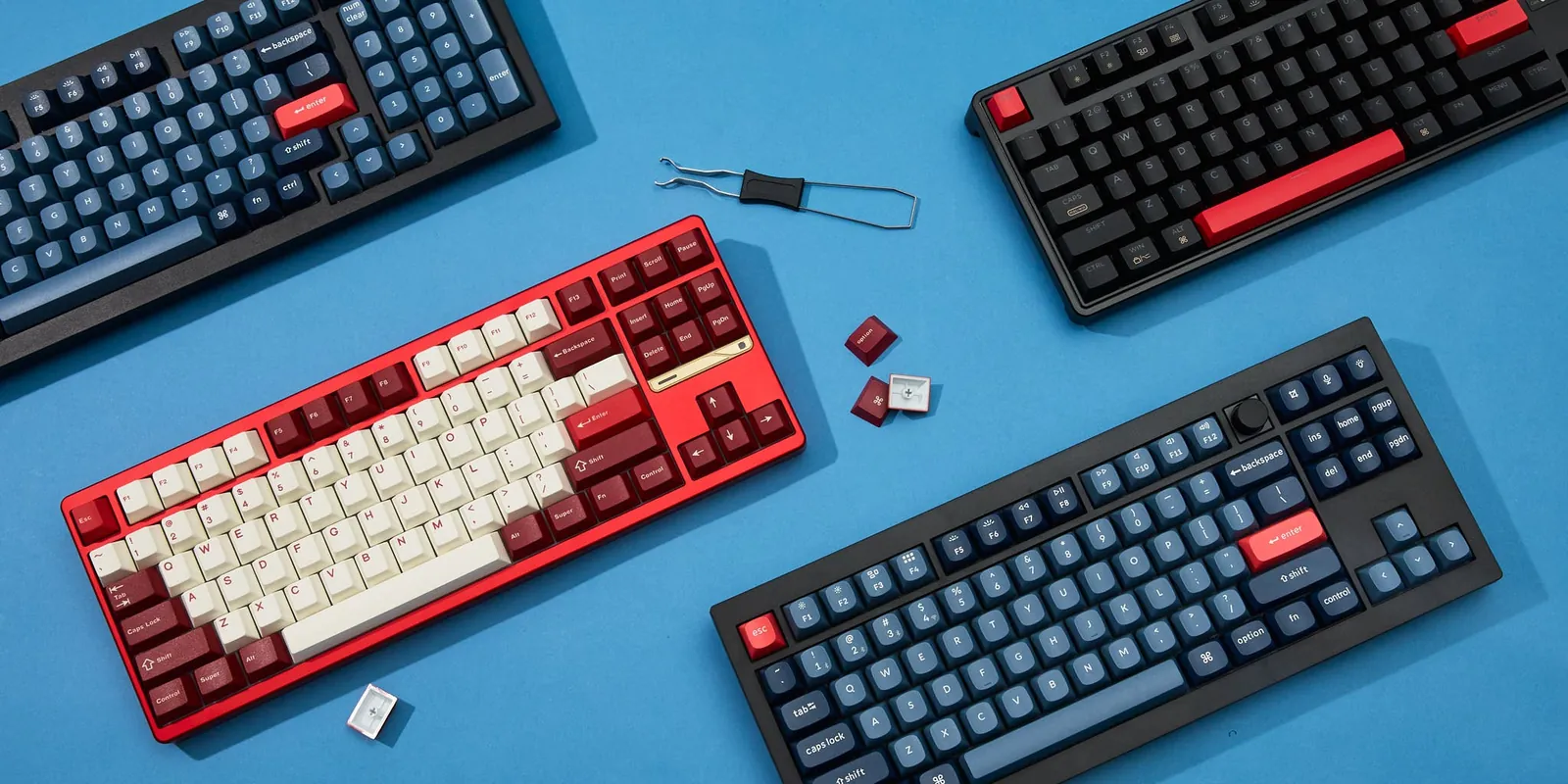 A heavy mechanical keyboard sits inside a travel backpack at a cafe.