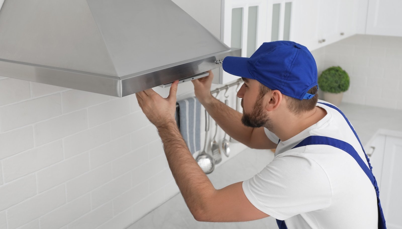 The precise and clean connection point of a professionally installed range hood.