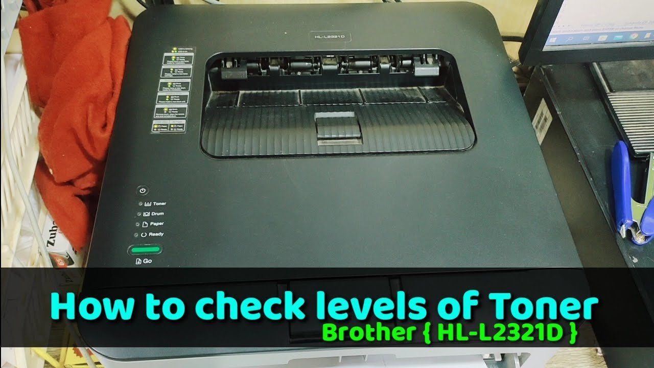 A person inspecting the internal ink cartridge slot of a modern office printer.