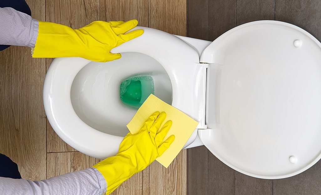 A clean and modern bathroom featuring a white toilet with the seat cover closed.