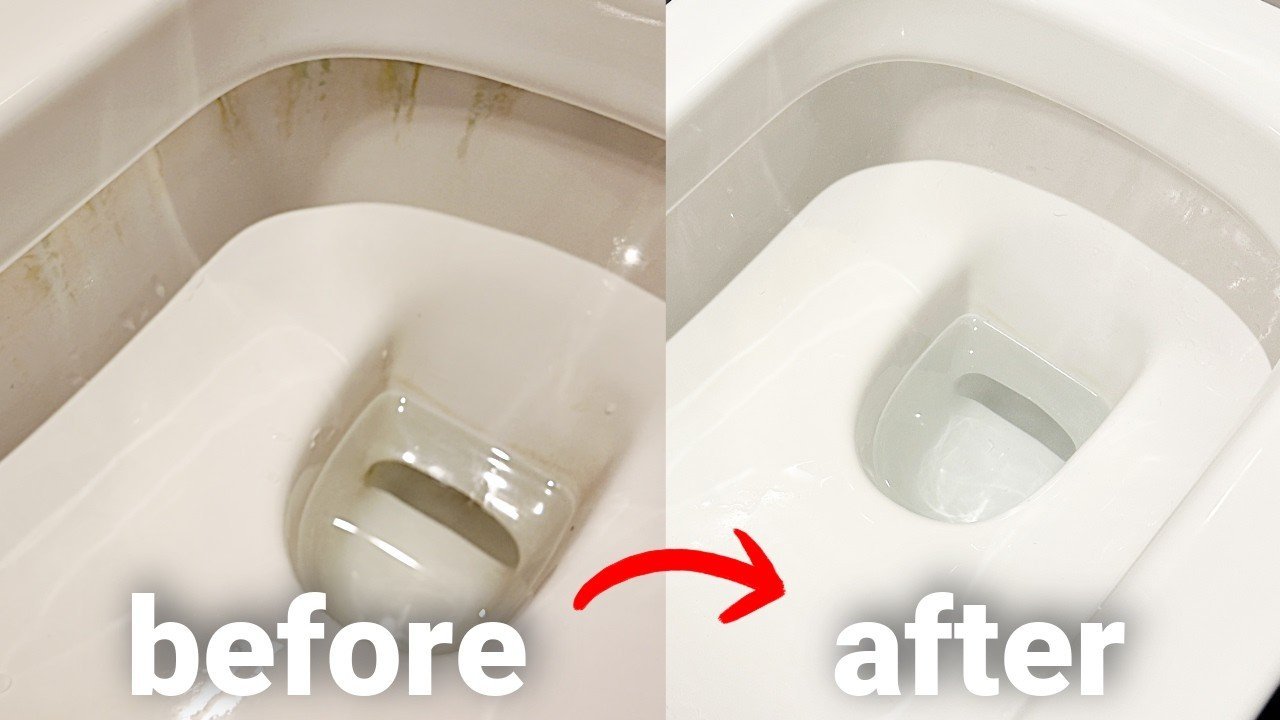 A person inspecting a discolored toilet seat in a bright bathroom setting.