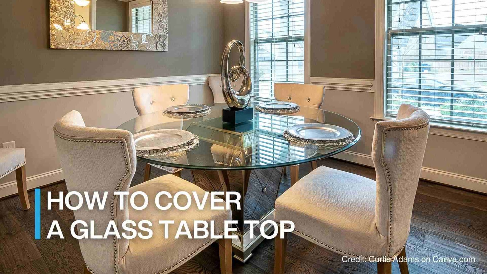 A functional glass dining table styled for daily use with a wooden tray.