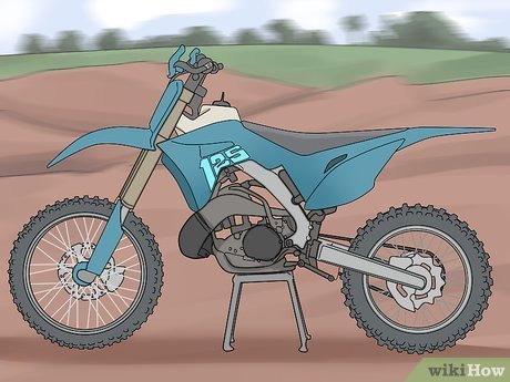 A rider's hand demonstrates the correct technique for operating a motorcycle clutch lever.