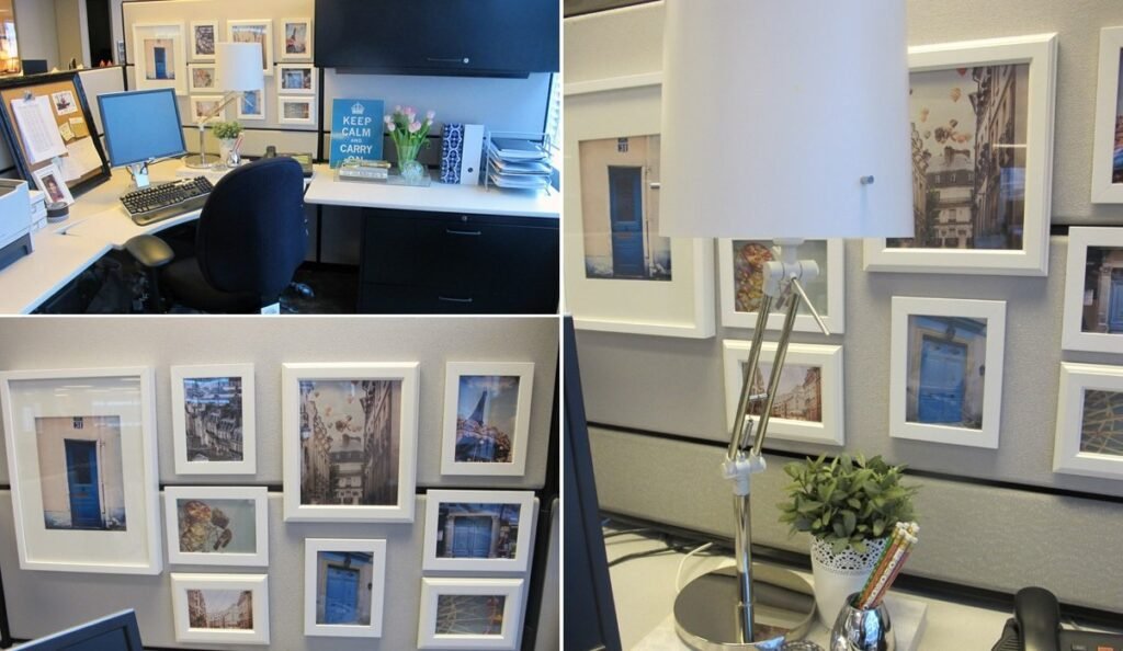 An organized office cubicle decorated with hanging items on the fabric partition walls.