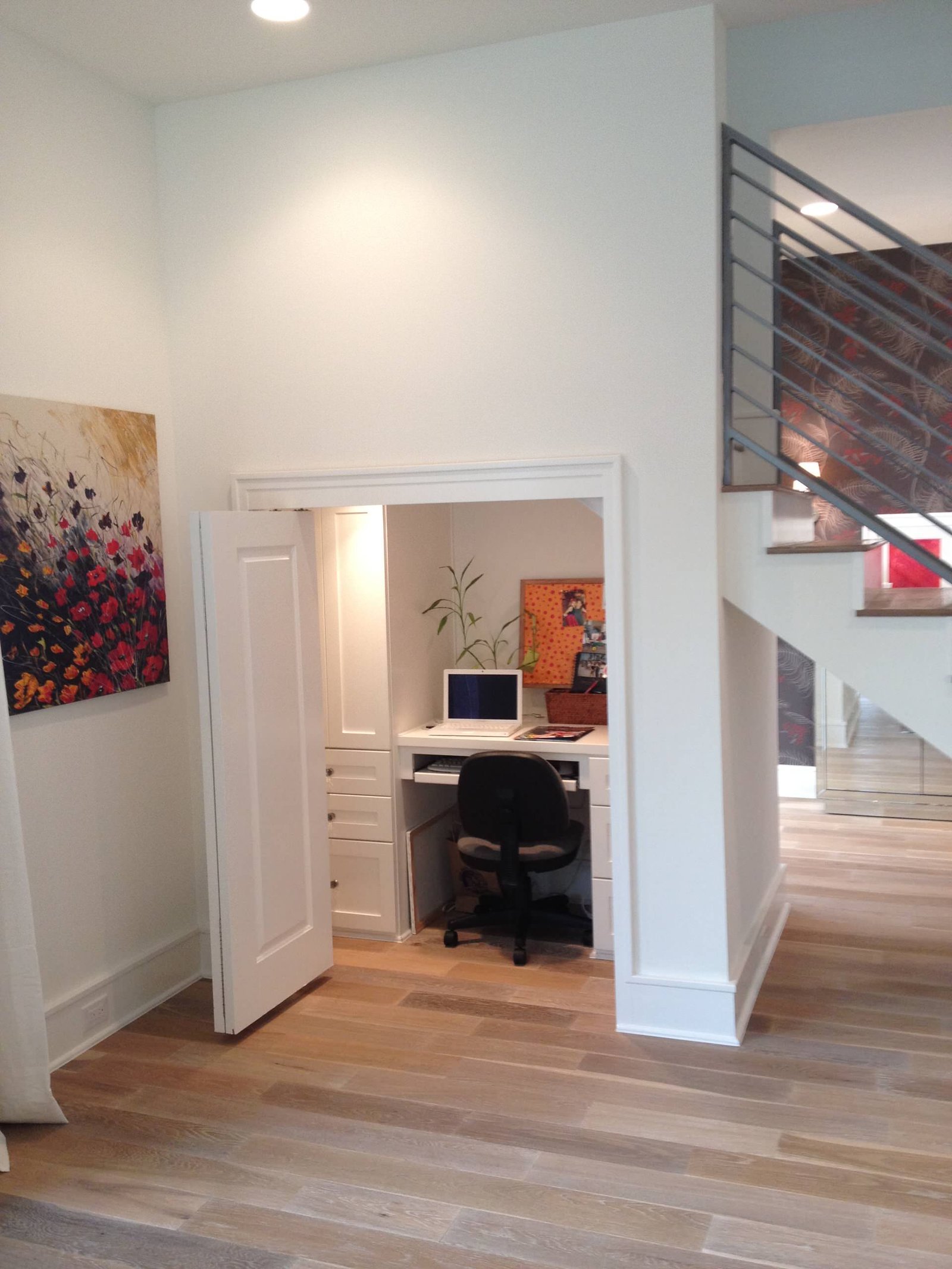 An open, high-performance home office setup that is too large for cabinet storage.