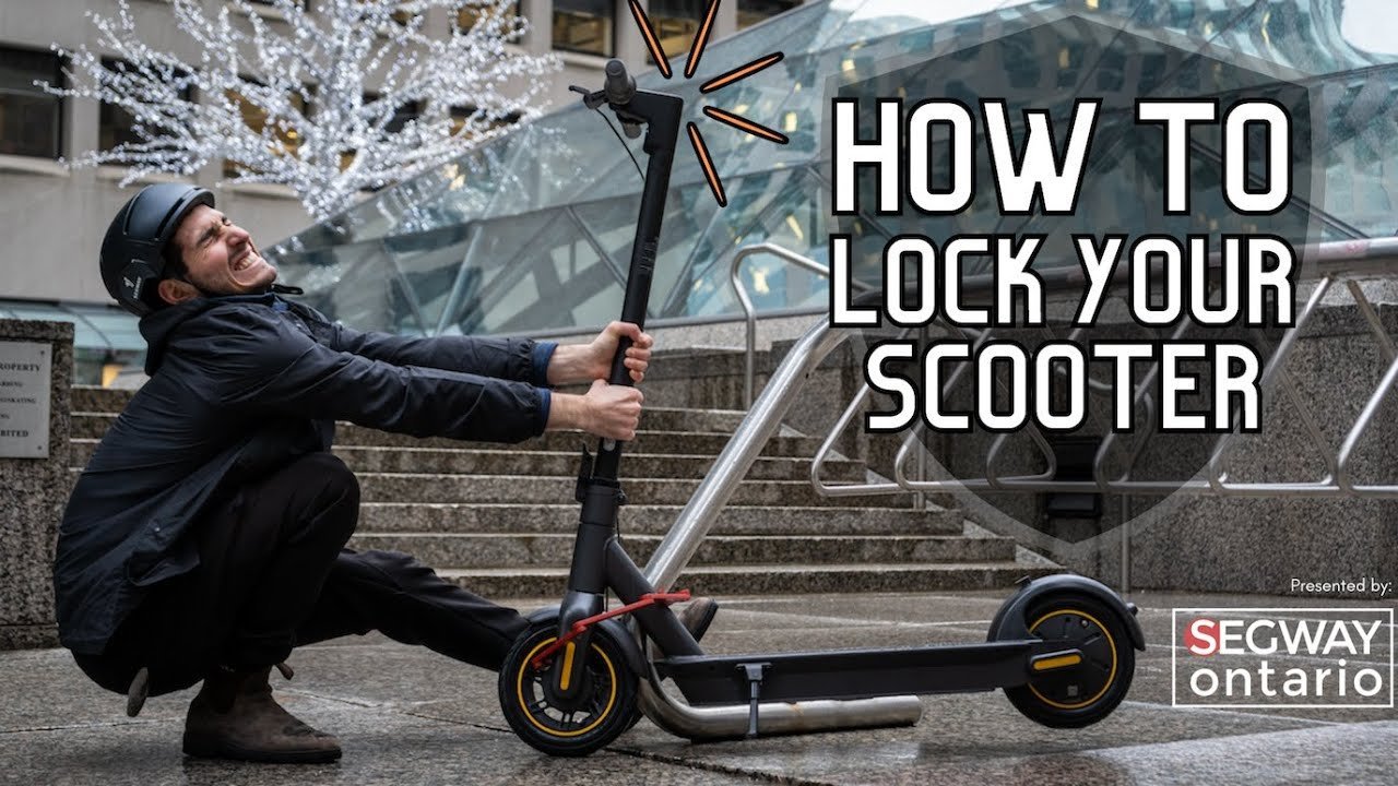 Hands pulling on scooter handlebars to test the strength of the lock.