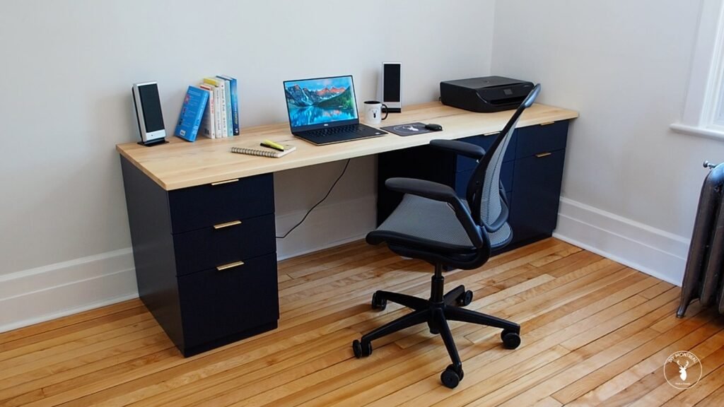 A handcrafted wooden desk top sits in a bright and modern home office.