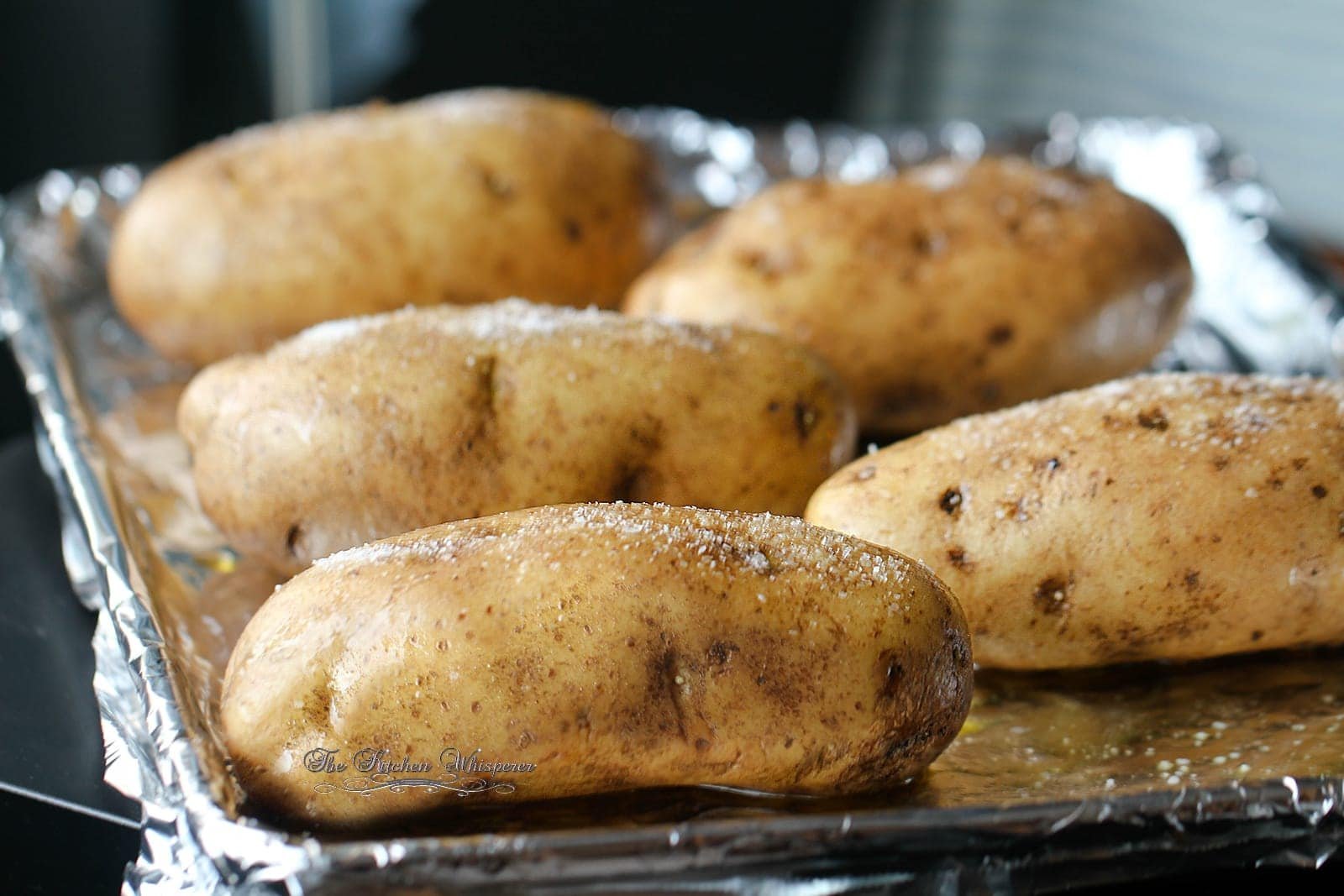 High-starch potato varieties like Russets ready for making a perfect oven jacket potato.