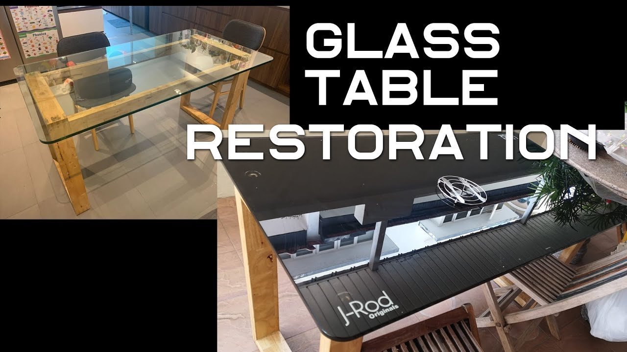 Essential supplies like primer and tape for painting a glass table top.