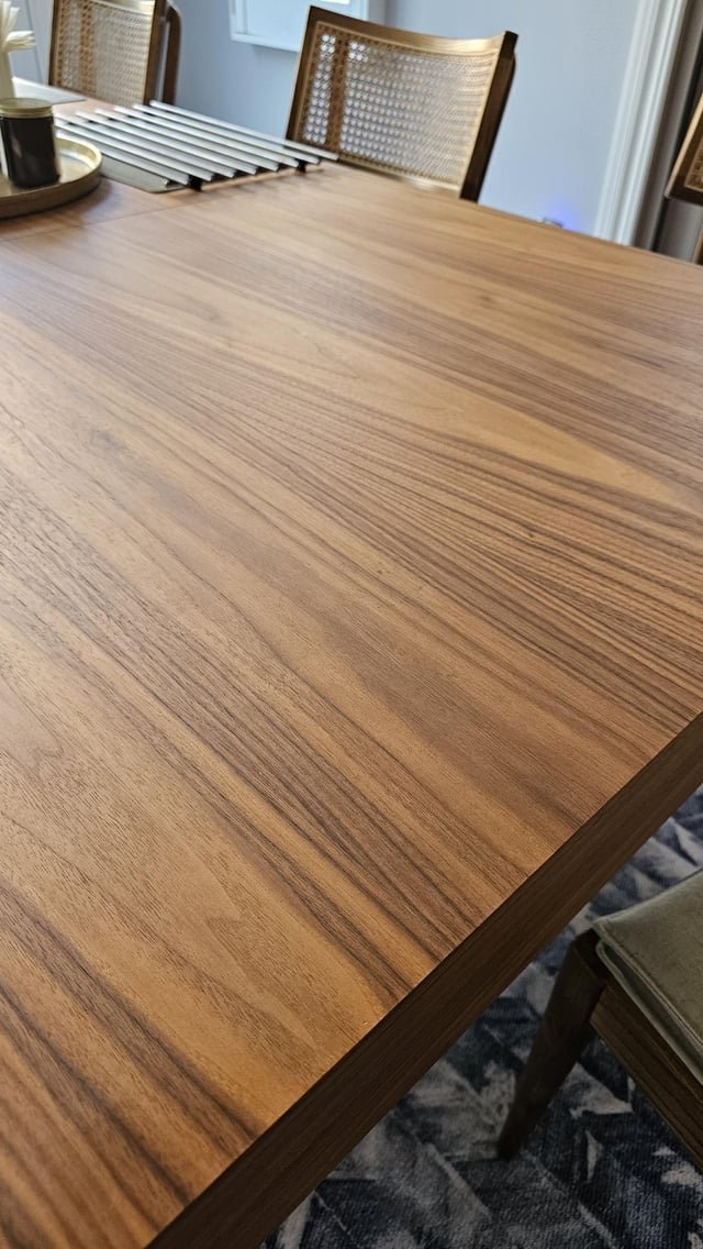A well-maintained veneer table in a bright dining room showing consistent care.