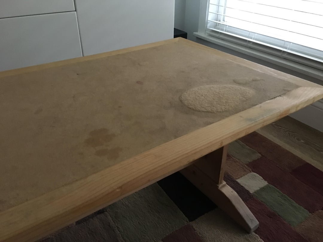 A cross-section of damaged MDF showing how water ruins the fiberboard core.