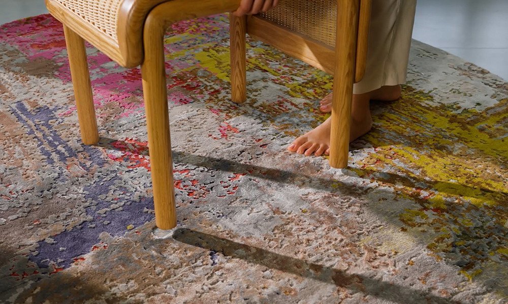 Plastic furniture sliders protecting carpet from heavy dresser damage.
