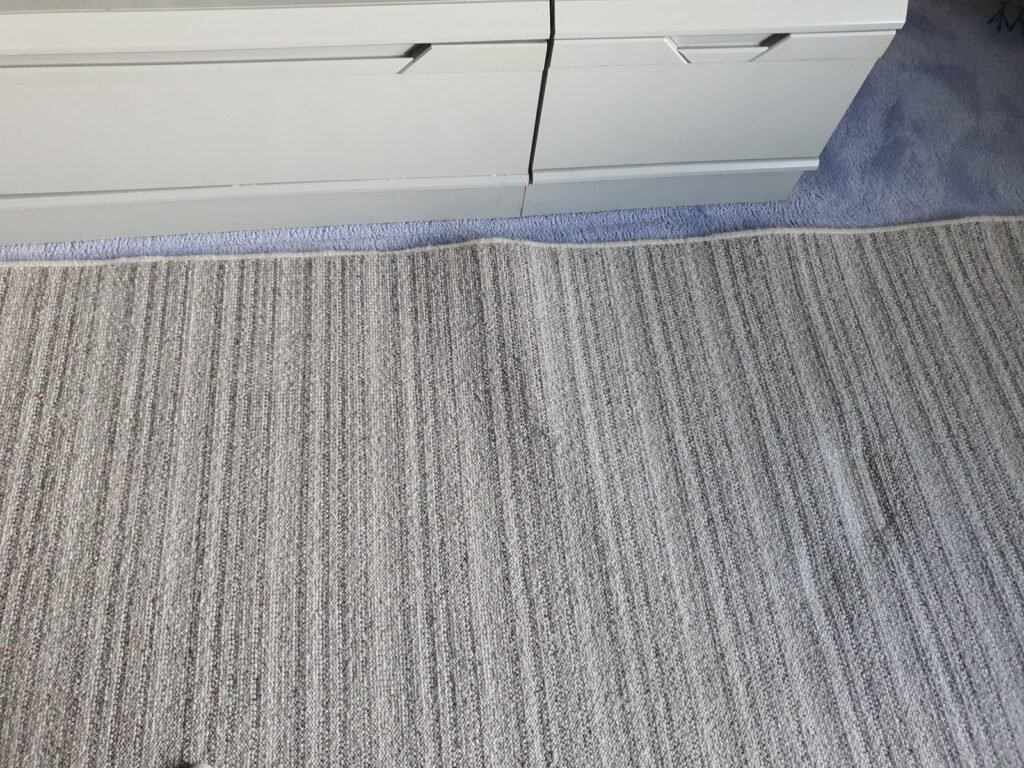 A subtle ripple in a neutral carpet shows how to smooth out bumps.