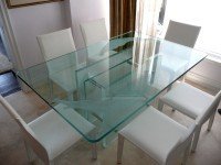 A glass tabletop securely positioned inside an SUV for safe transport.