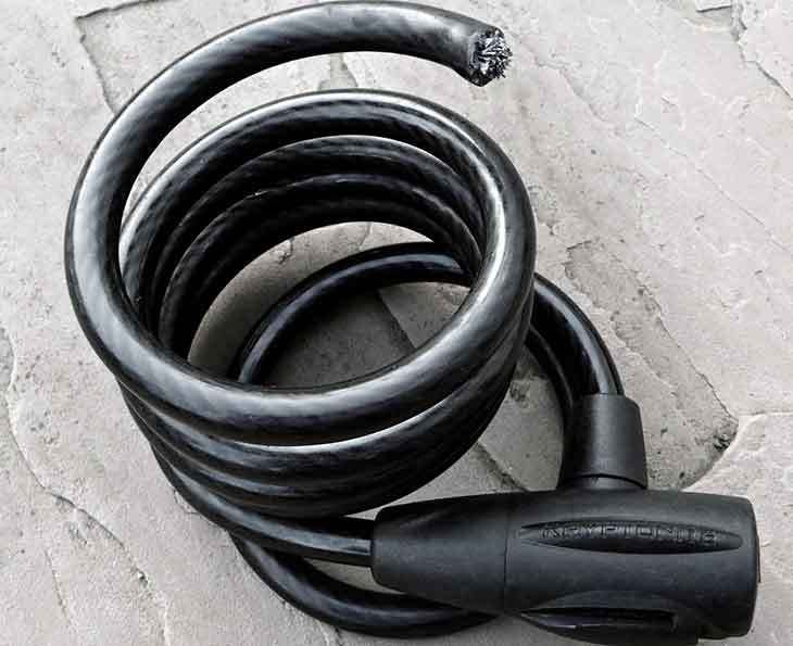 Essential bike security tools including a steel cable lock and extra security hardware.