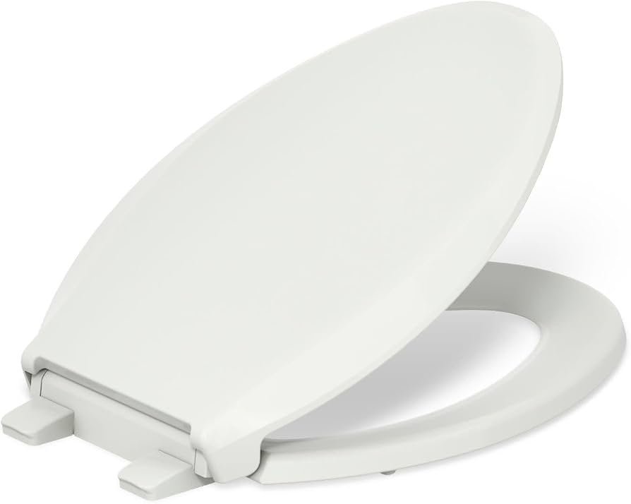 A Kohler Cachet Readylatch elongated toilet seat installed in a bright, clean modern bathroom.