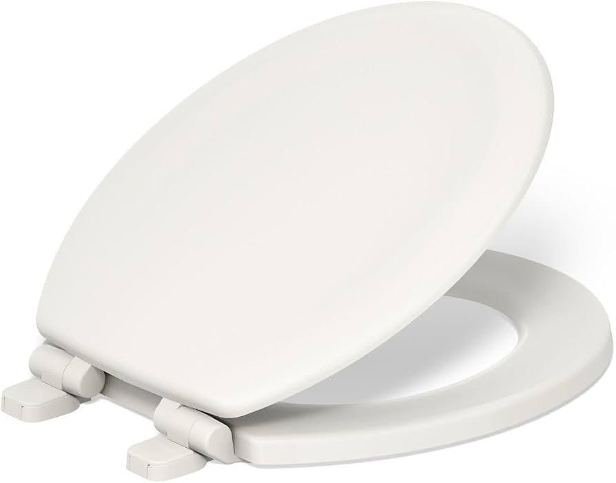 A modern Kohler Stonewood toilet seat installed in a bright, minimalist bathroom setting.