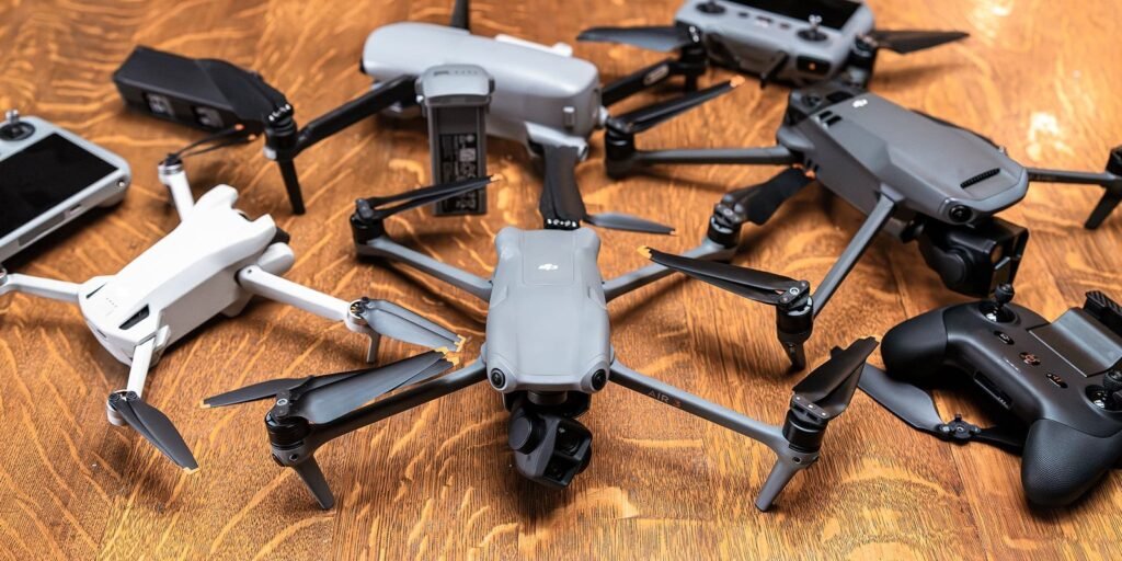 A sleek drone with obstacle avoidance sensors hovering in a scenic green park.